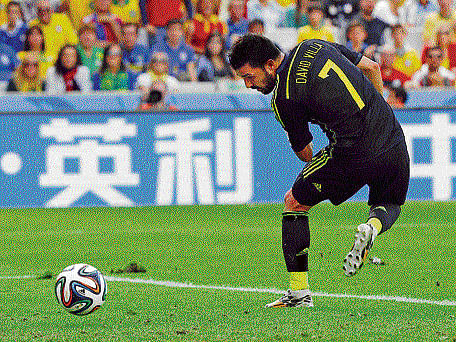 pure skill Spain's David Villa back-flicks the ball into the net on Monday. La Roja defeated Australia 3-0. reuters