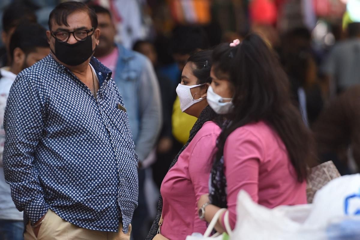 People wearing facemasks amid fears of the spread of COVID-19 novel coronavirus. (AFP Photo)