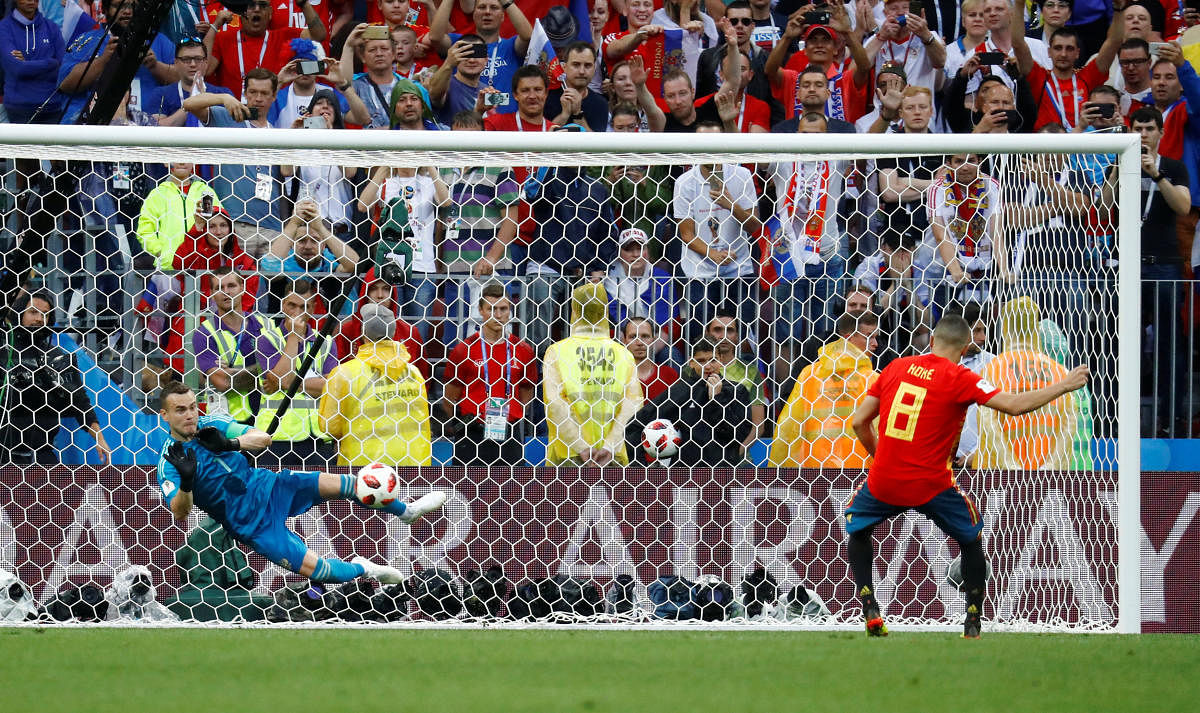 Russia's Igor Akinfeev saves a penalty from Spain's Koke during the shootout. Reuters photo