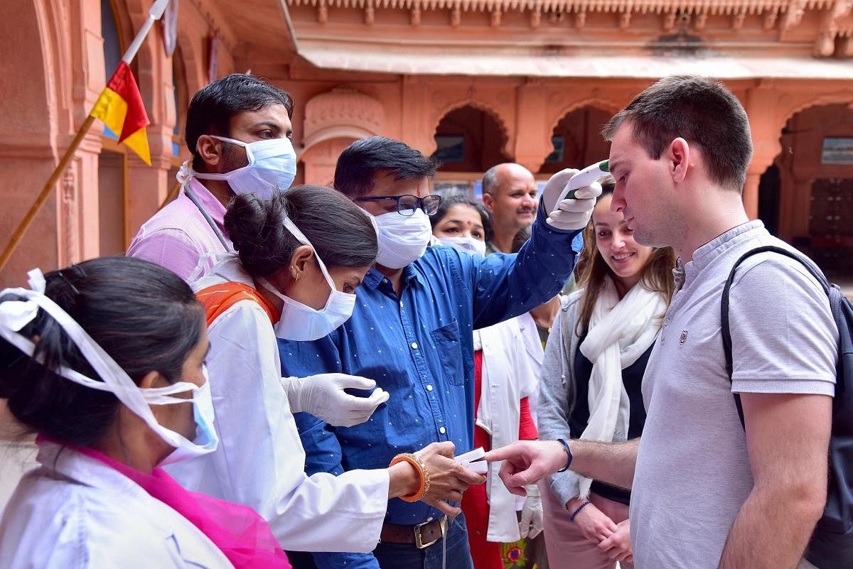 Medical officials check tourists in wake of the deadly coronavirus, at Junagarh fort in Bikaner. (PTI Photo)