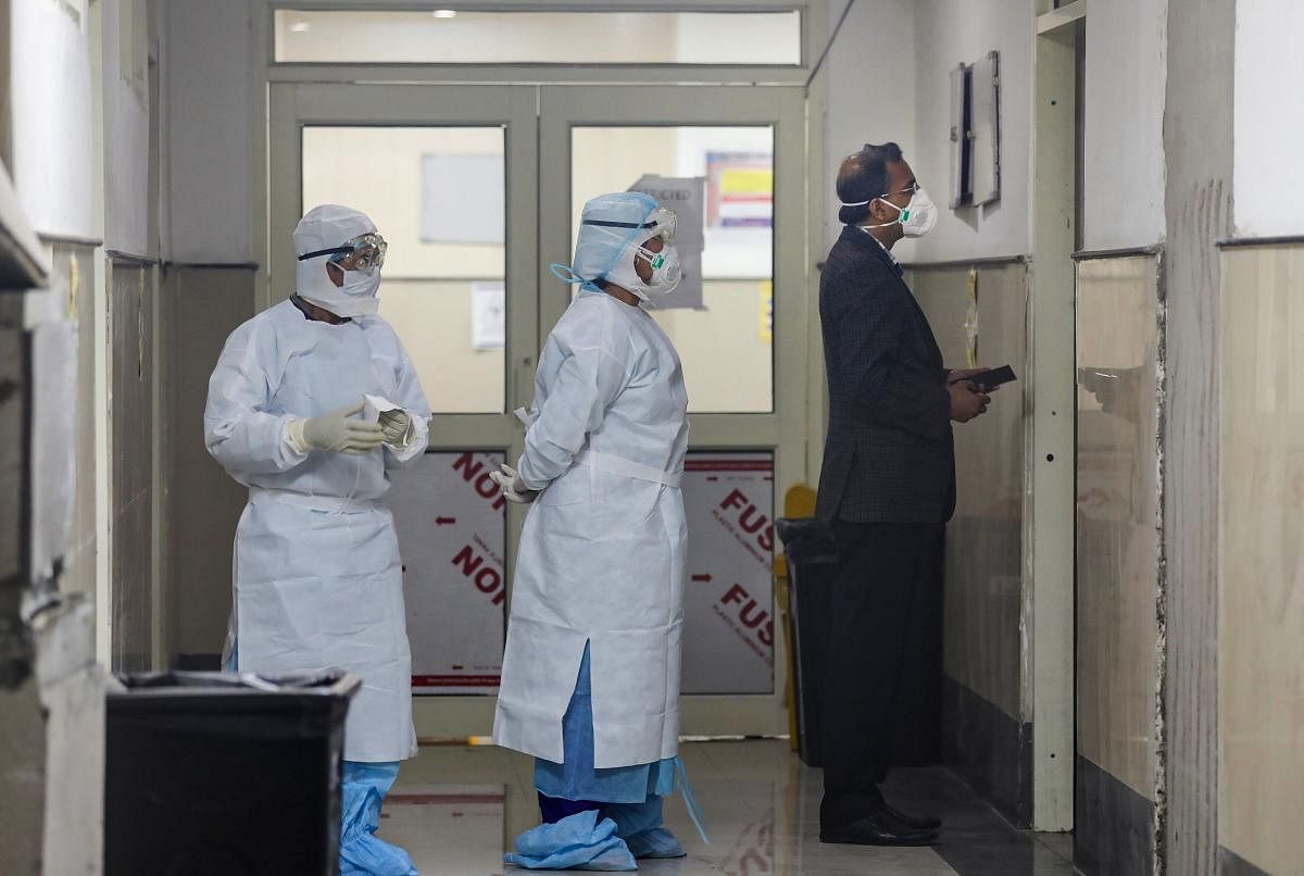  Medics wearing protective masks inside the novel coronavirus isolation ward of Government Medical College Hospital (PTI Photo)