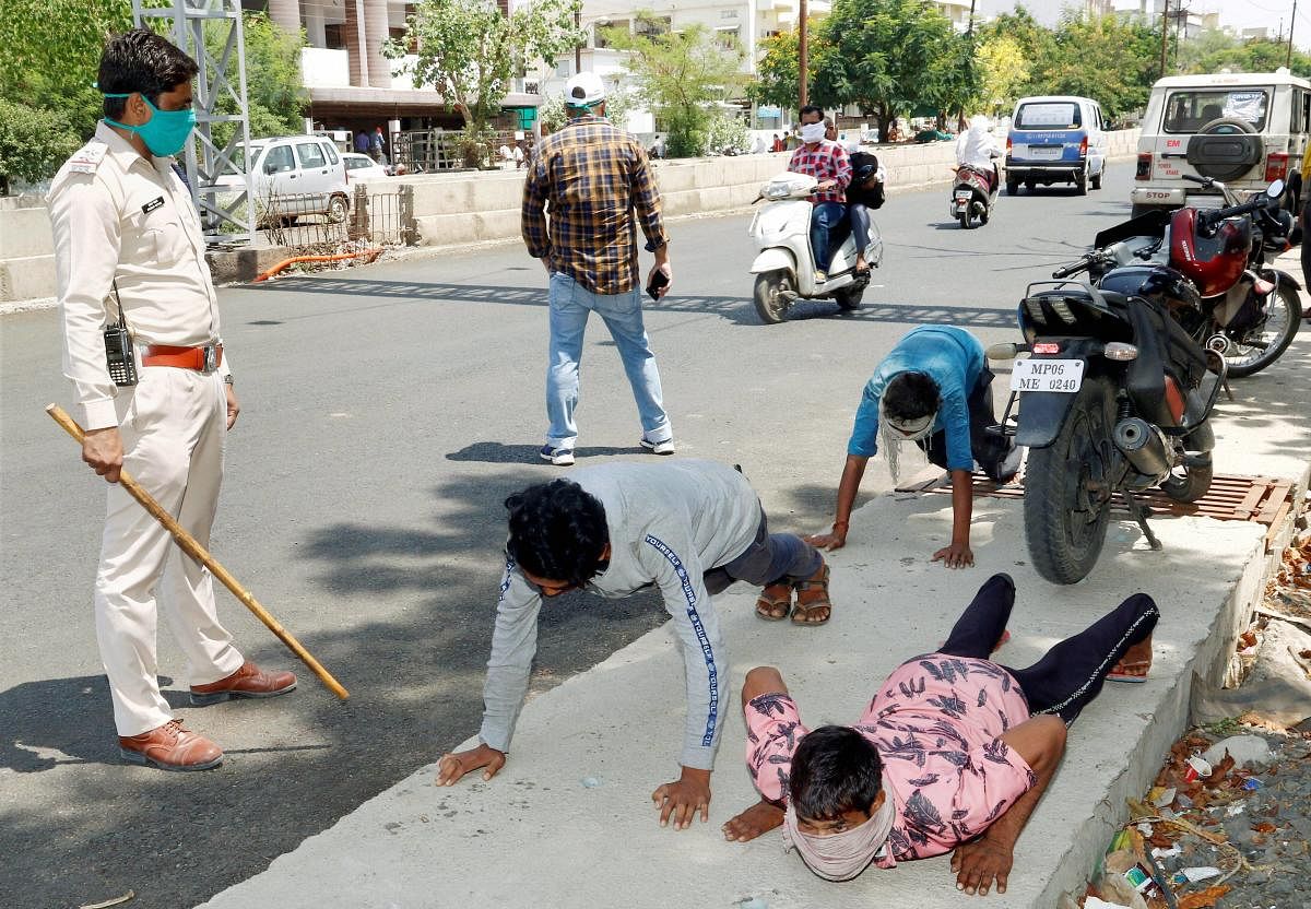 Police punish the offenders of COVID-19 lockdown in Madhya Pradesh (PTI Photo)