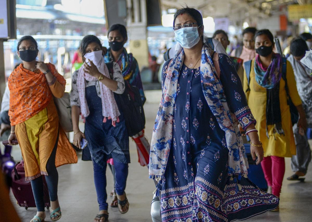 Passengers wear masks as a preventive measure against coronavirus (PTI Photo)