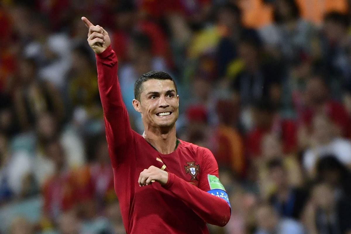 Cristiano Ronaldo scored a stunning hat-trick as Portugal snatched a 3-3 draw with Spain in a World Cup classic here Friday. AFP