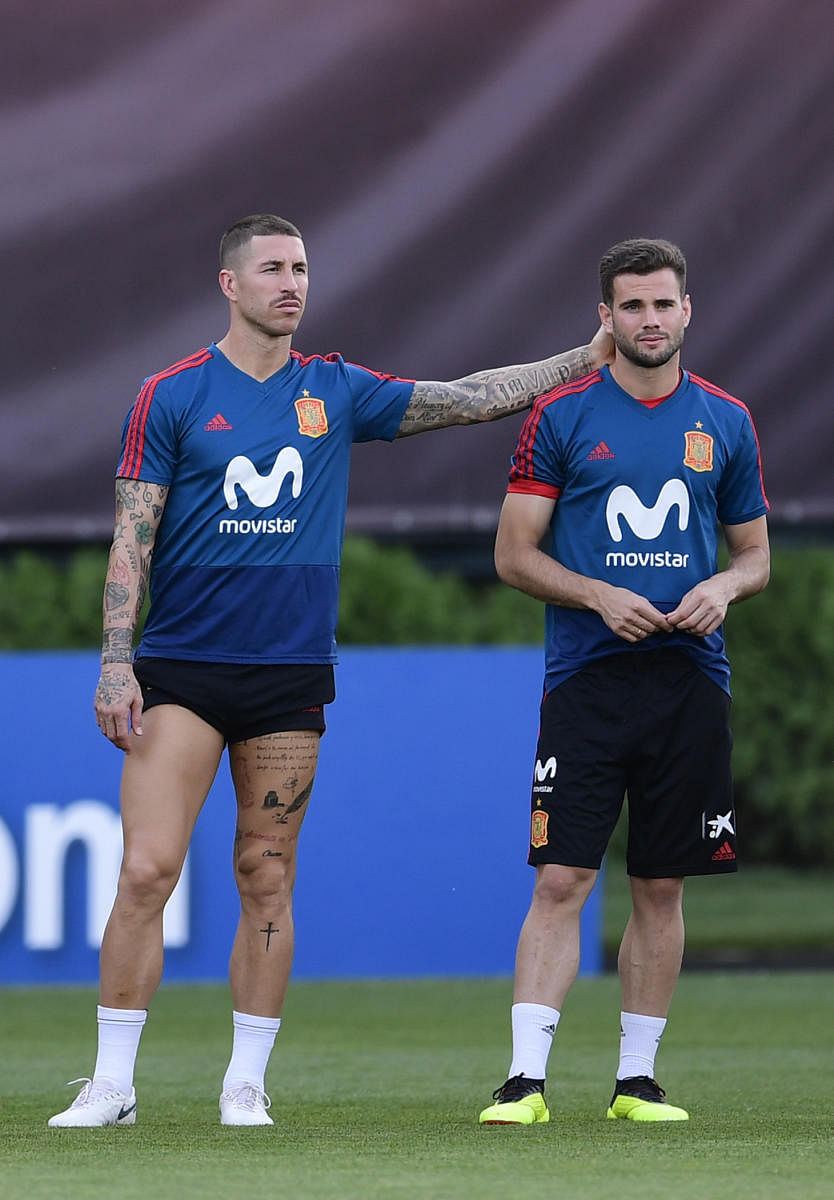 FOCUSSED: Spain's Sergio Ramos (left) and his partner in defence Nacho Fernandez will have to up their game against a dangerous Russian side. AFP