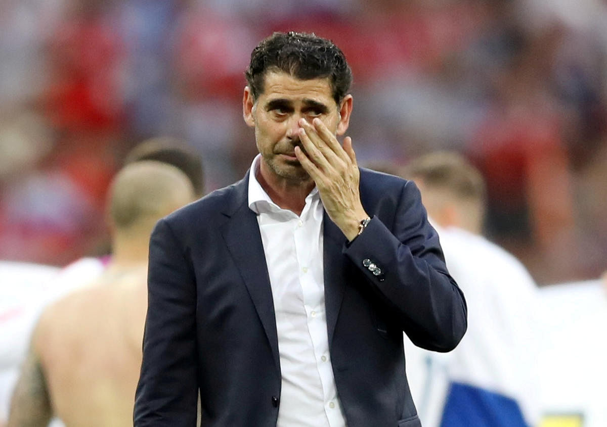 Spain coach Fernando Hierro looks dejected after losing the penalty shootout. REUTERS