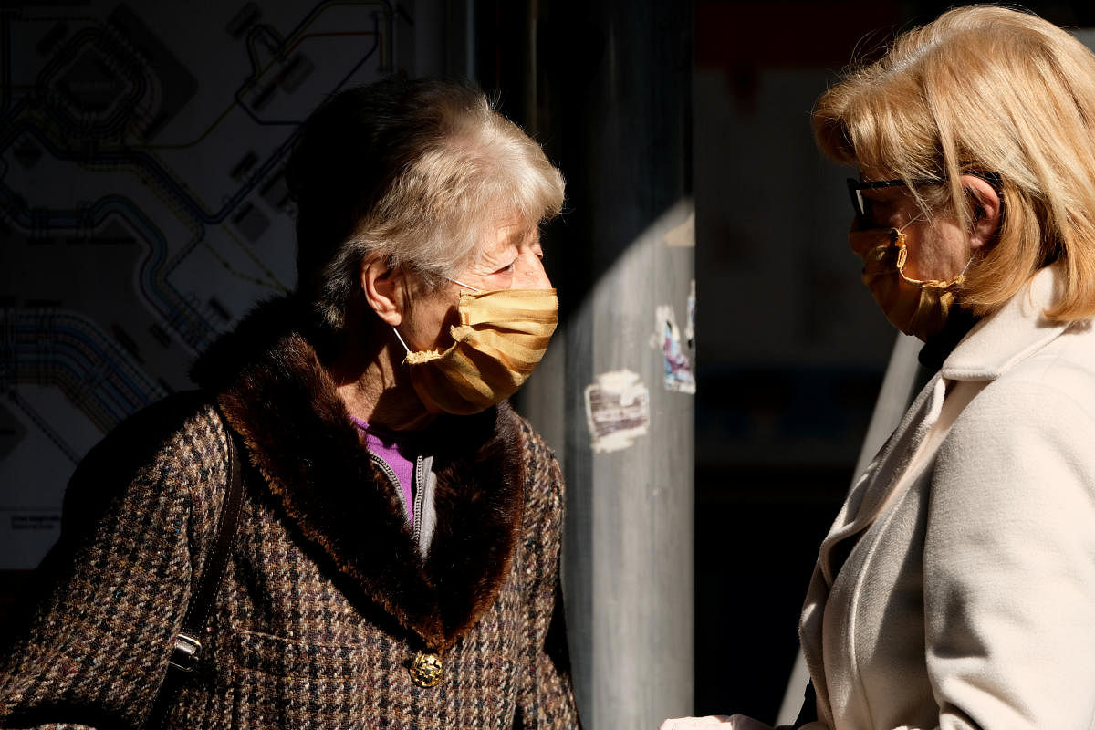 People wearing protective masks are seen in Venice on the second day of an unprecedented lockdown across of all Italy imposed to slow the outbreak of coronavirus, in Venice. Credit: Reuters Photo