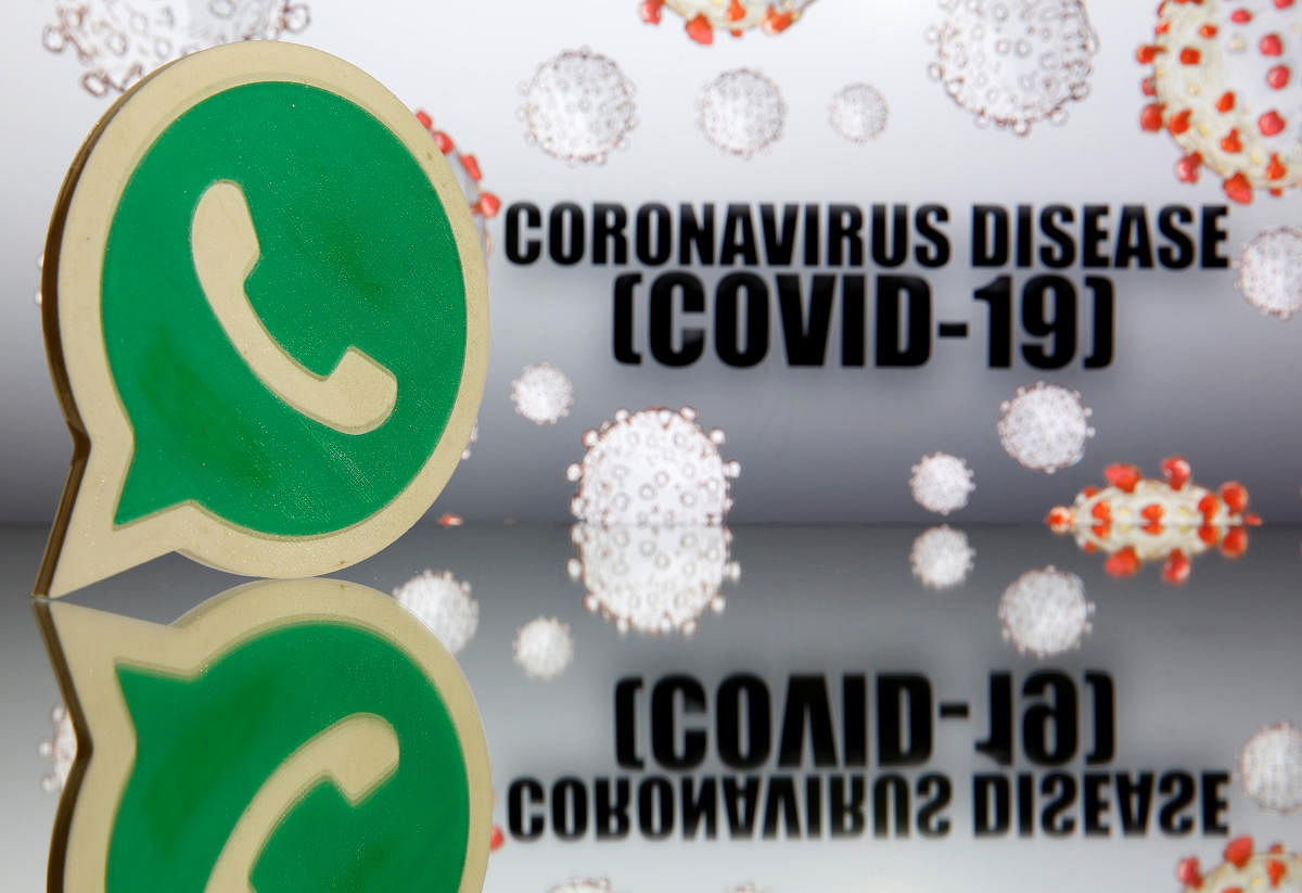 Whatsapp logo is seen in front of displayed coronavirus disease (COVID-19) (Reuters Photo)