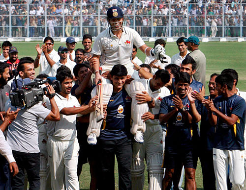 Mumbai players carry Sachin Tendulkar on shoulders as they celebrate after beating Haryana in their Ranji Trophy match in Rohtak on Wednesday. PTI Photo