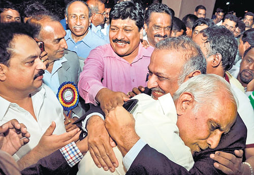jubilant: Secretary-elect Brijesh Patel (centre) celebrates with his supporters after winning the KSCA elections on Sunday. dh photo