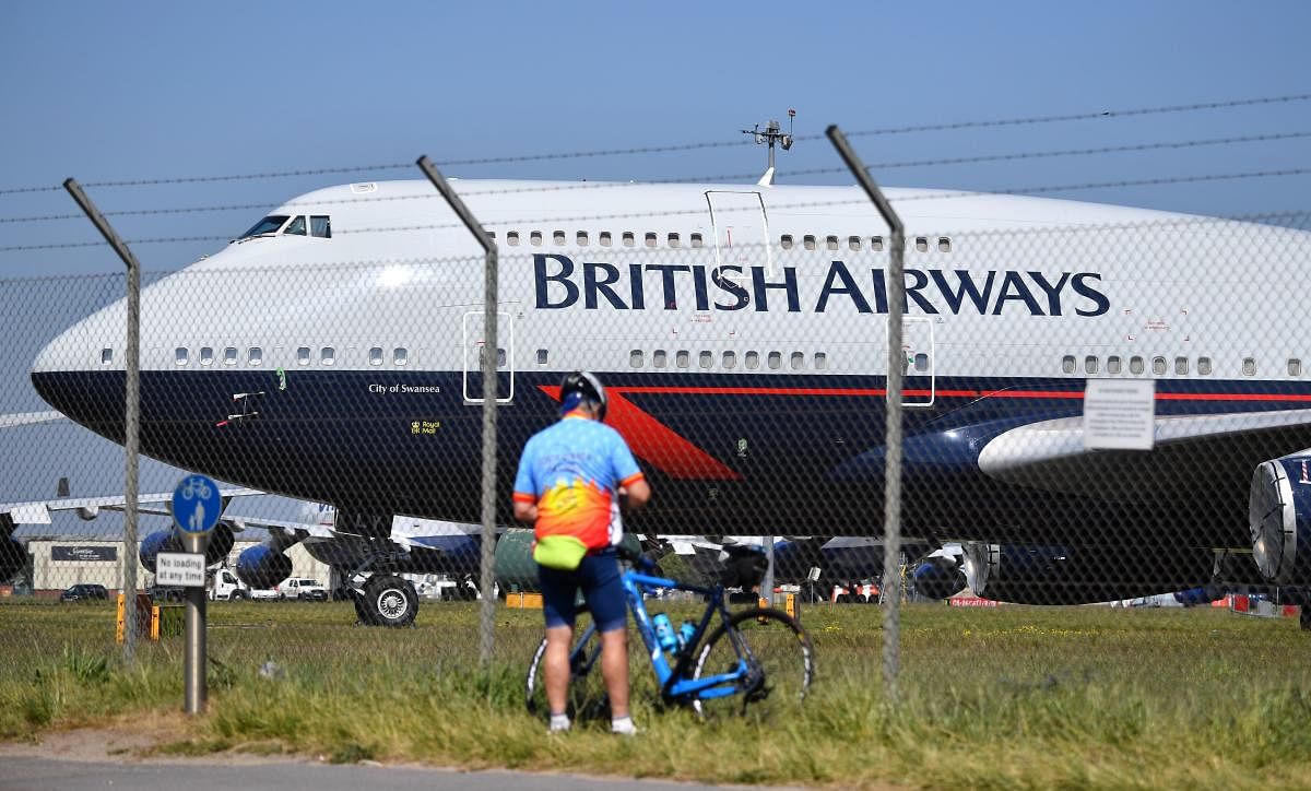IAG, the owner of British Airways and Spanish carrier Iberia, nosedived into the red in the first quarter on the back of coronavirus fallout. (AFP Photo)