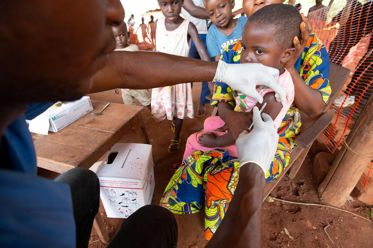 A child is given a measles vaccination during an emergency campaign run by Doctors Without Borders (MSF) in Likasa, Mongala province in northern Democratic Republic of Congo March 3, 2020. Credit: Reuters Photo