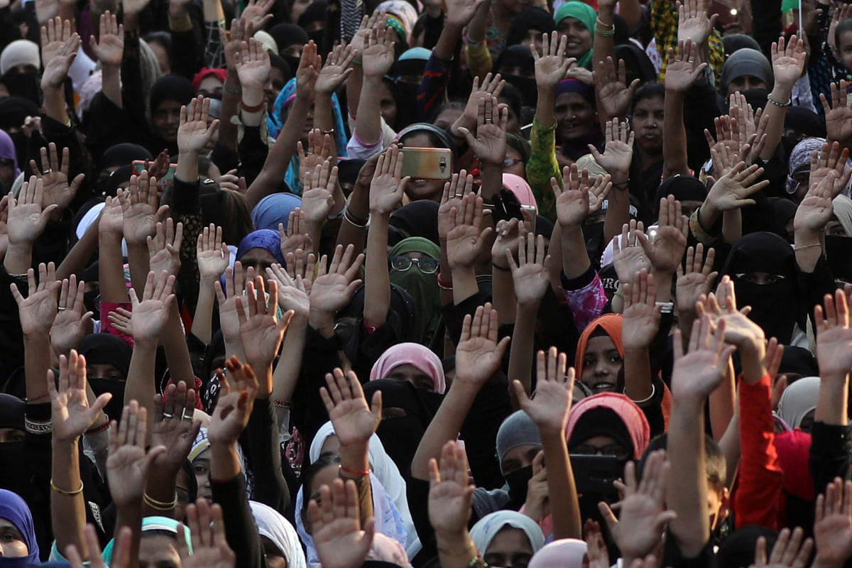 Demonstrators gesture during a protest against a new citizenship law on the outskirts of Mumbai. (Reuters photo)