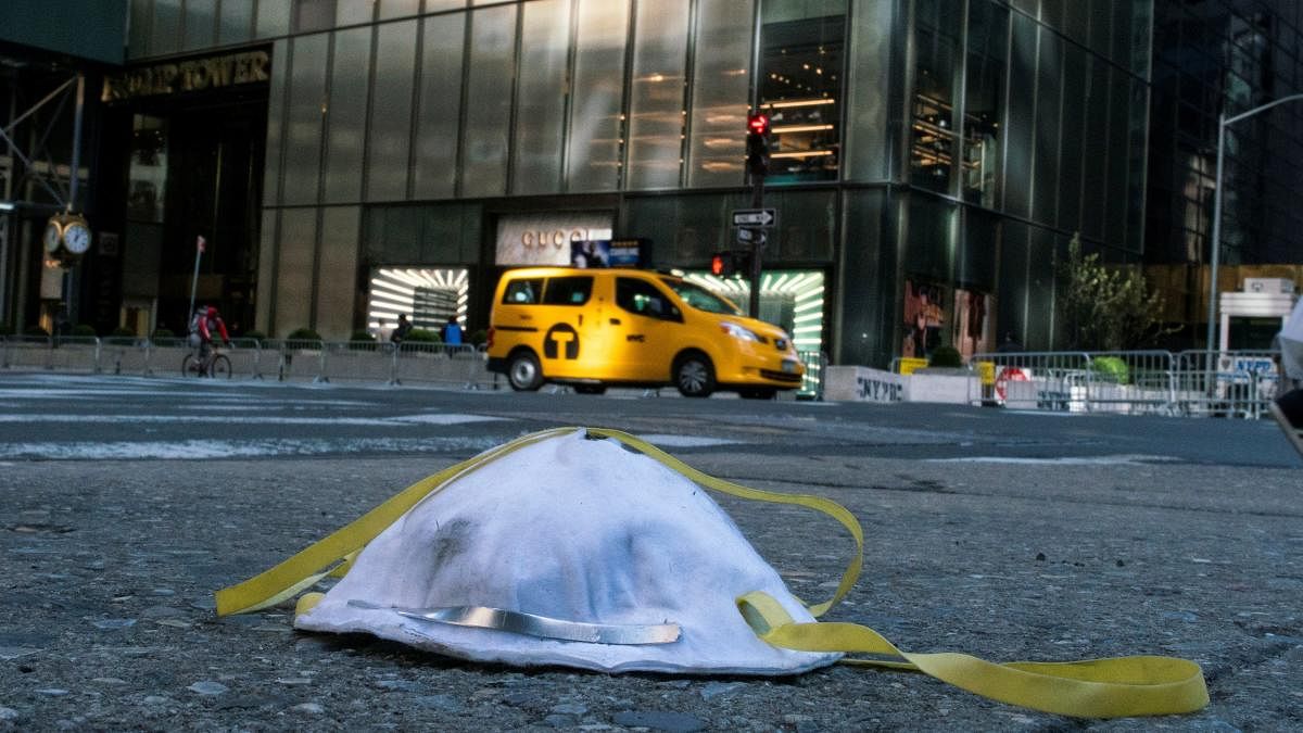 A face mask used to protect from the coronavirus disease (COVID-19) is seen on the ground near Trump Tower in New York City, New York, U.S., March 14, 2020. (REUTERS Photo)