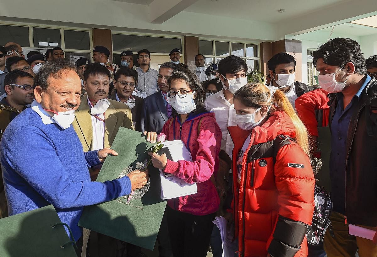 Union Minister of Health and Family Welfare Harsh Vardhan interacts with Indians who were air-lifted from Wuhan following out-break of the deadly novel cornavirus, before their release from the ITBP quarantine facility, at Chhawla, in New Delhi, Monday, Feb 17,2020. Credit: PTI Photo