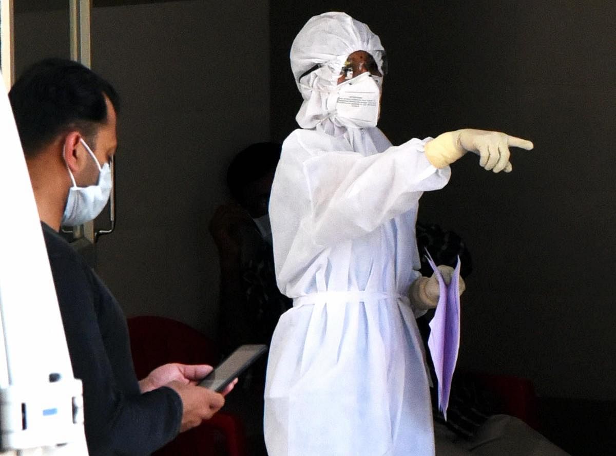 A medic wearing protective suit is seen outside an isolation ward, set up in view of coronavirus pandemic, at Aluva Government General Hospital in Kochi. PTI