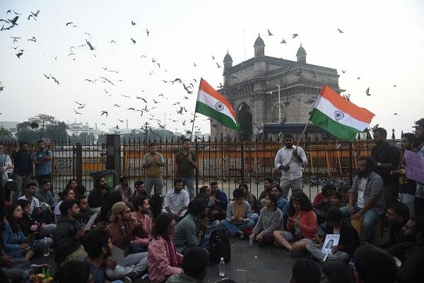 Students stage a protest near the Gateway of India to condemn the violence at Delhi's, Jawaharlal Nehru University, in Mumbai, Monday, Jan. 6, 2020. (PTI Photo/Shashank Parade)