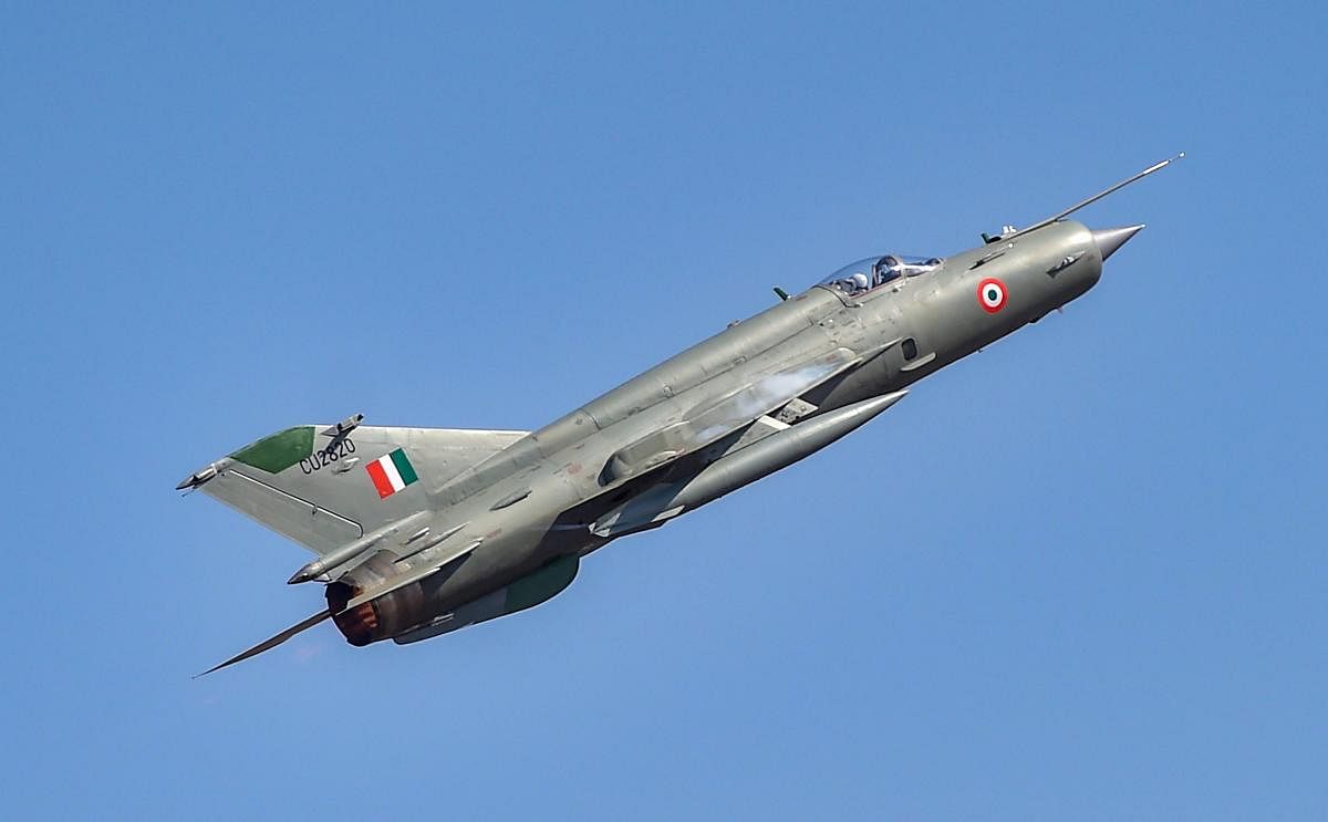 A MIG-21 aircraft flies past during the inauguration of the 12th edition of AERO India 2019 air show at Yelahanka airbase in Bengaluru, Wednesday, Feb 20, 2019. (PTI Photo)