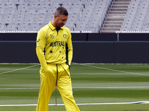 Australia's captain Michael Clarke inspects the pitch ahead of their Cricket World Cup final match against New Zealand at the Melbourne Cricket Ground. Reuters Photo