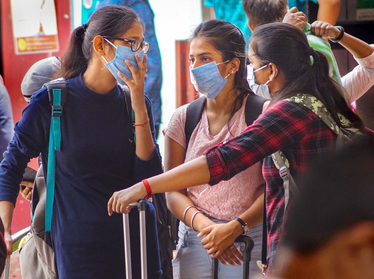  Passengers wear masks as a preventive measure against novel coronavirus (COVID-19) pandemic, at Bhubaneswar railway station, Tuesday, March 17, 2020. (PTI Photo)