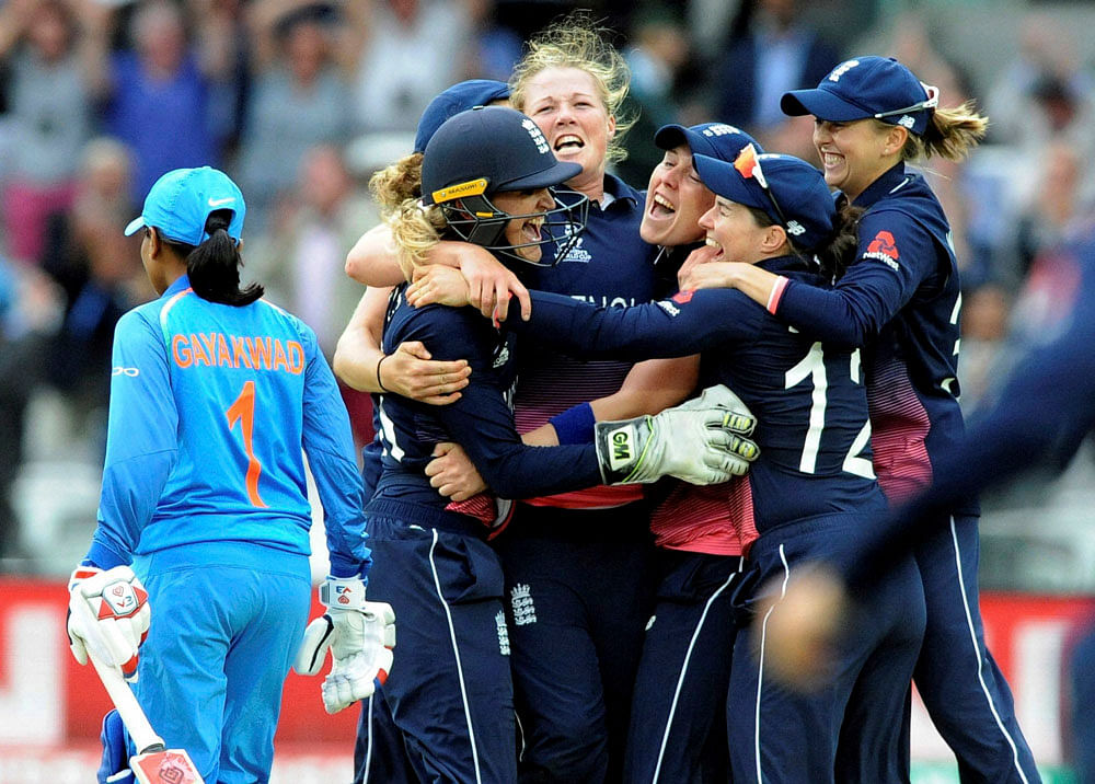 England's Anya Shrubsole, centre, celebrates with teammates as England win the ICC Women's World Cup 2017 final match against India at Lord's in London, England. AP/PTI