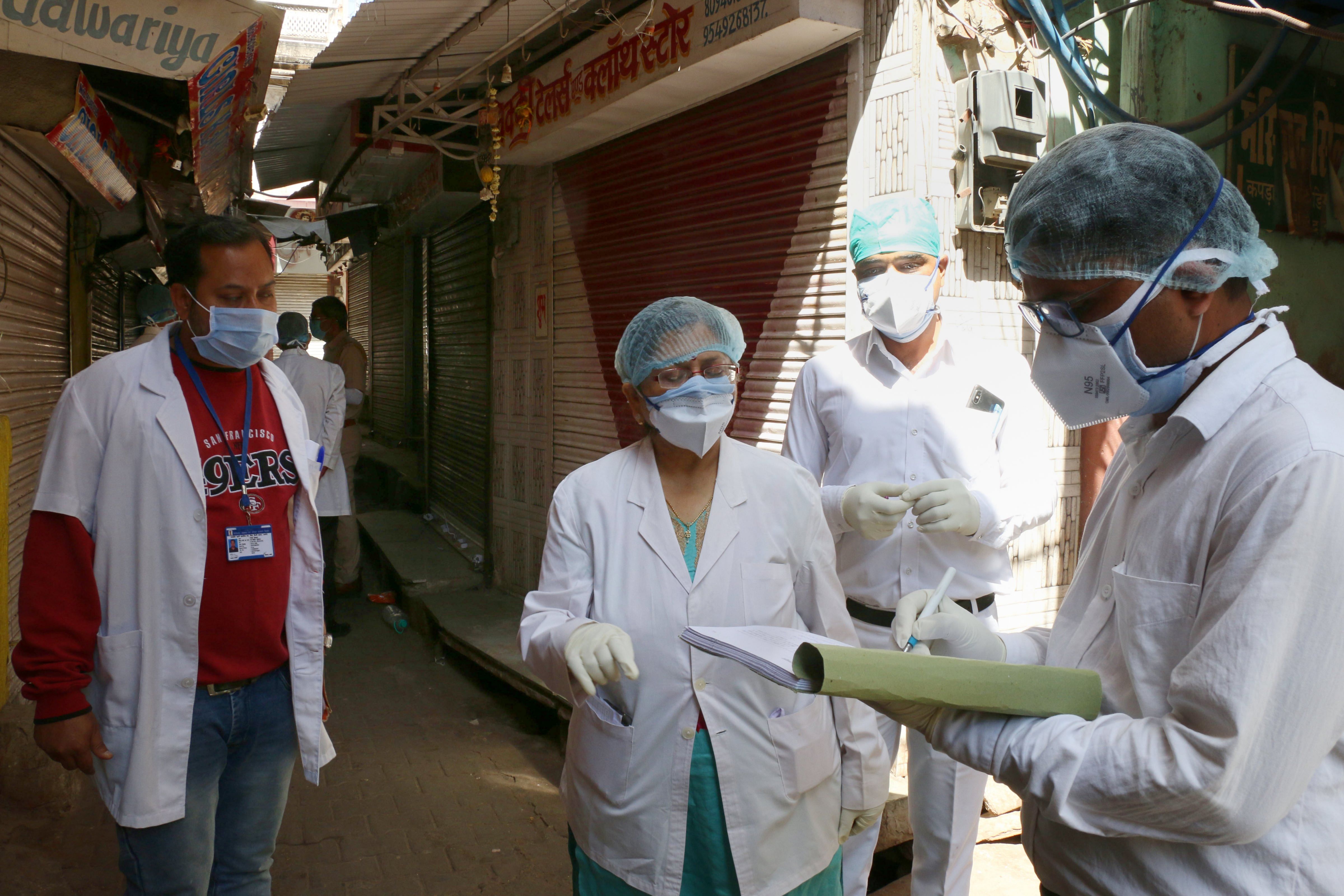 Health workers during a door-to-door survey for COVID 19 symptoms, during a nationwide lockdown imposed in the wake of the coronavirus pandemic, in Ajmer. (PTI Photo)