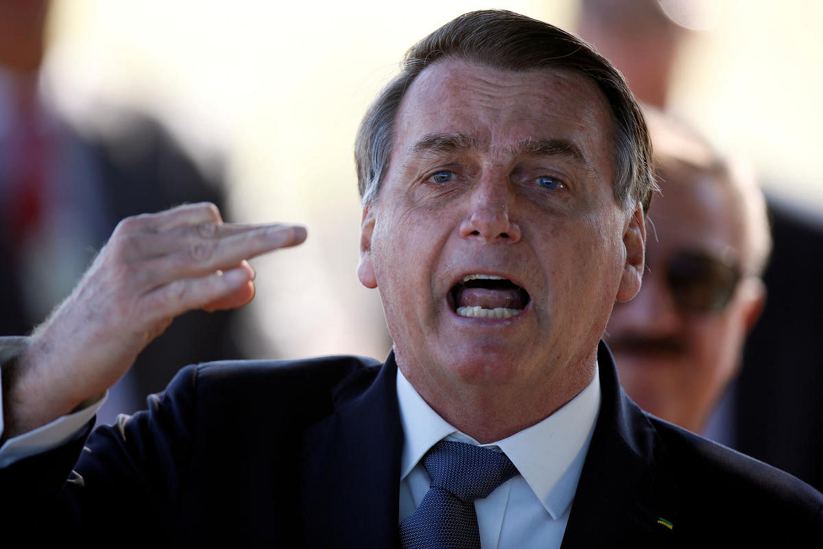 Brazil's President Jair Bolsonaro reacts as he leaves Alvorada Palace, amid the coronavirus disease (COVID-19) outbreak in Brasilia, Brazil May 5, 2020. Credit: Reuters File Photo