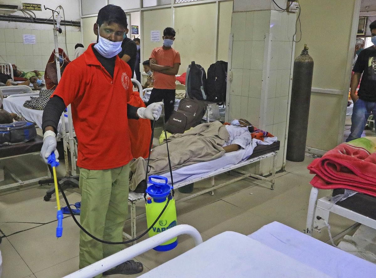 A worker sanitizes the general wards of Hospital in the wake of deadly coronavirus 'COVID-19 outbreak (PTI Photo)