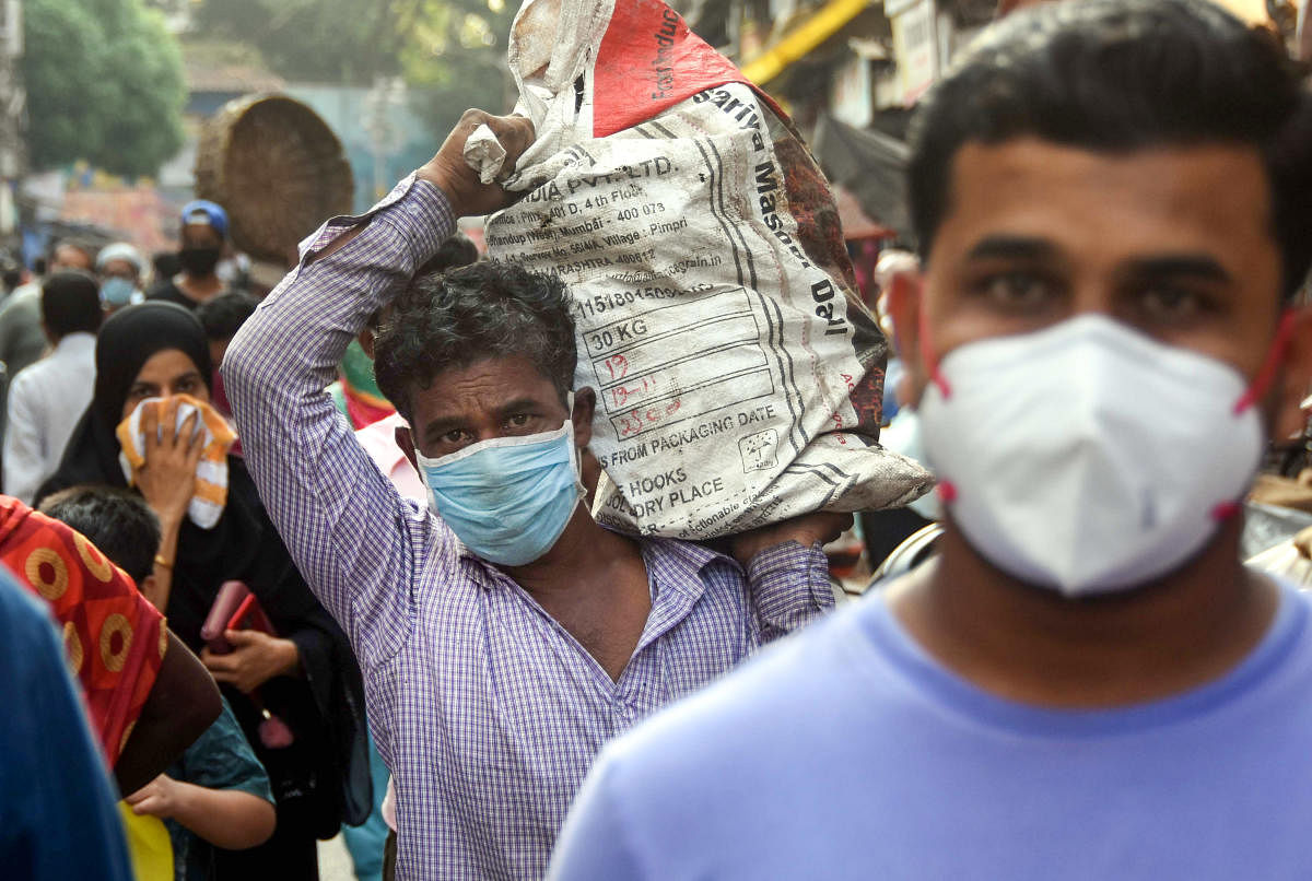 People wearing facemask to buy essentials in Mumbai amid COVID-19 outbreak (PTI Photo)