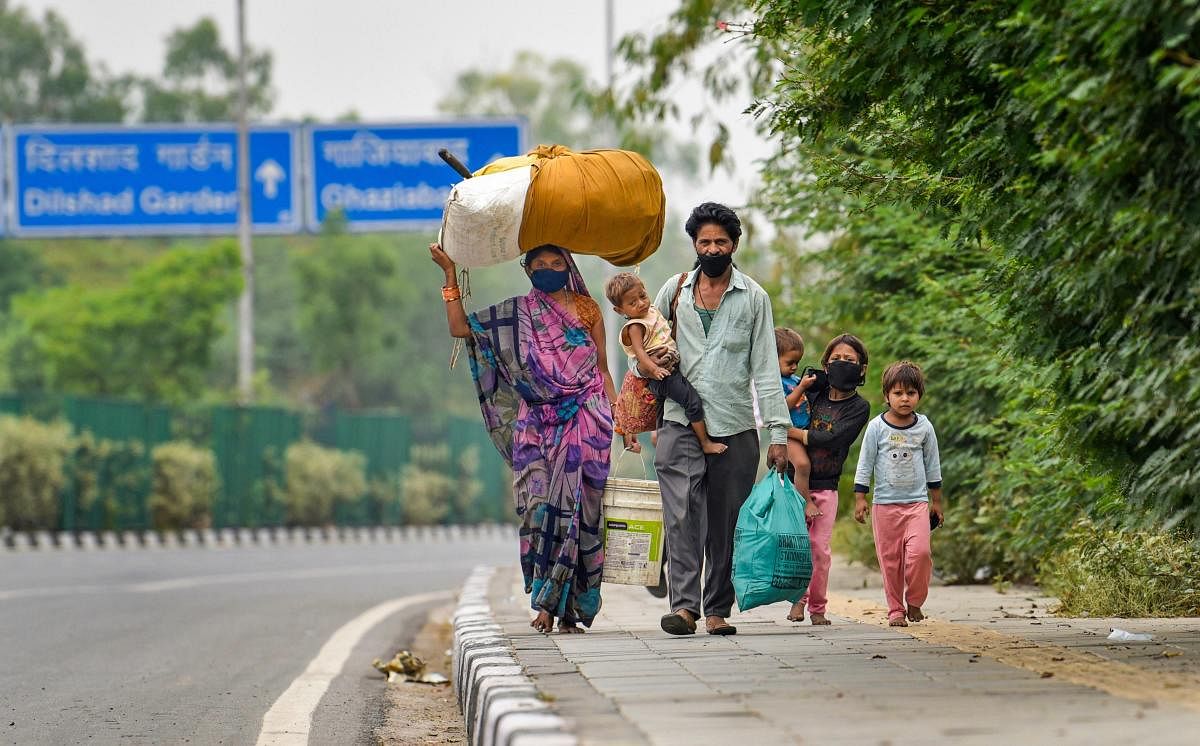  Migrant labourers walking on road (PTI Photo)