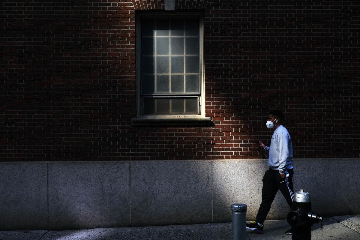  A man walks through the Financial District on May 11, 2020 in New York City.  Credit: AFP Photo