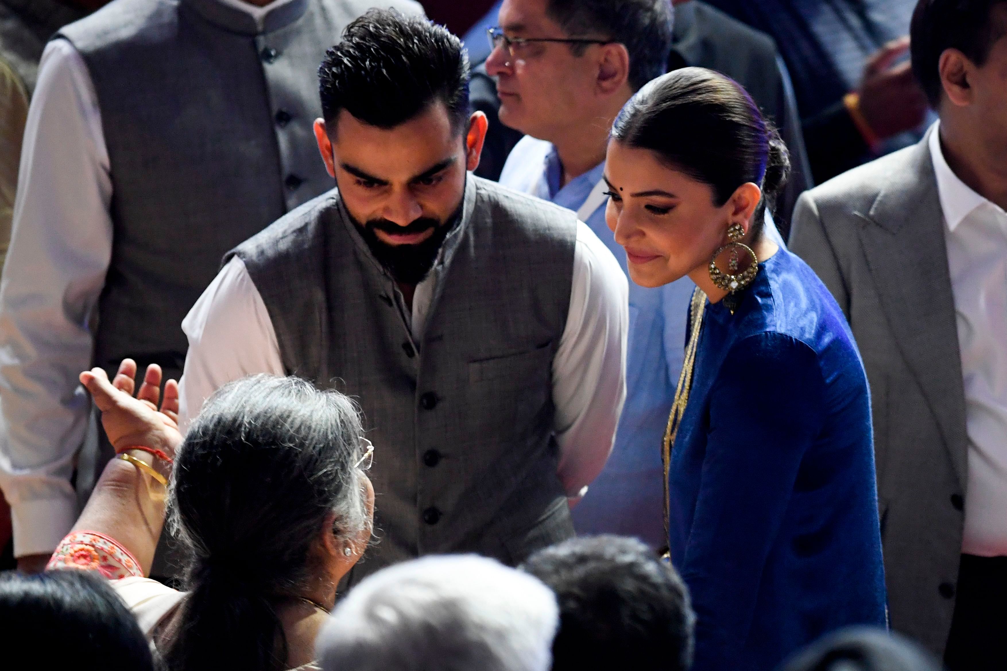 Indian cricket captain Virat Kohli (L) and wife Anushka Sharma. (Credit: AFP)