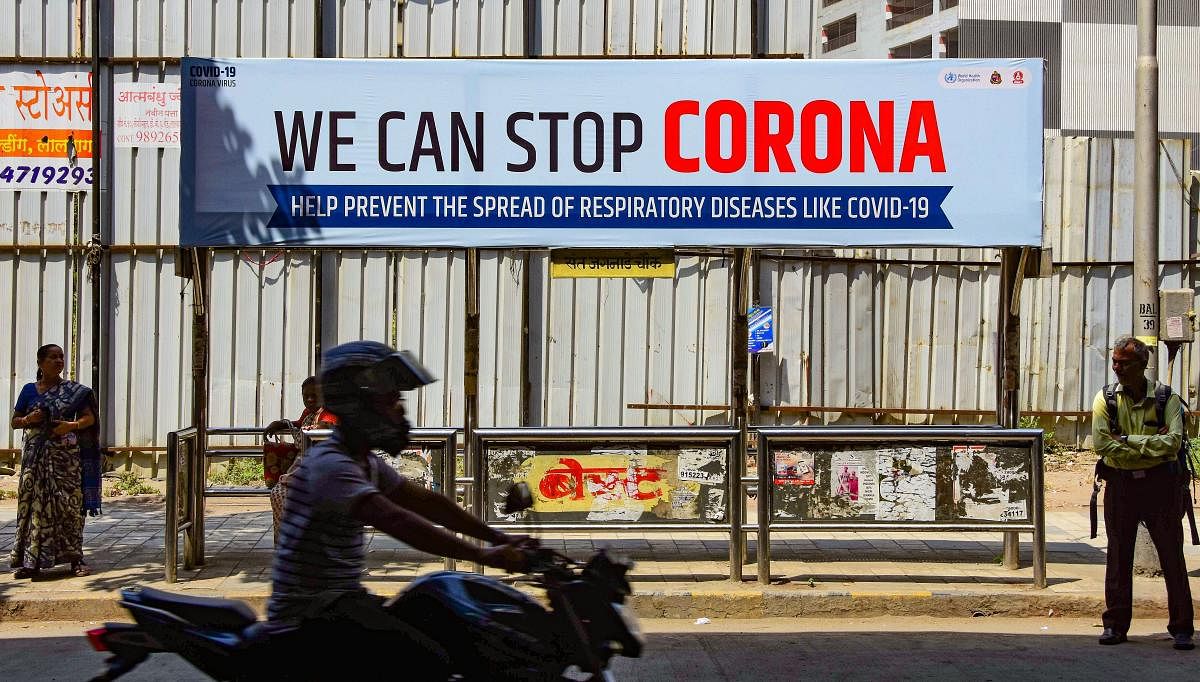  A billboard set up by BMC to raise awareness on the novel coronavirus (COVID-19) outbreak, at a bus stop in Mumbai, Monday, March 16, 2020. Credit: PTI Photo