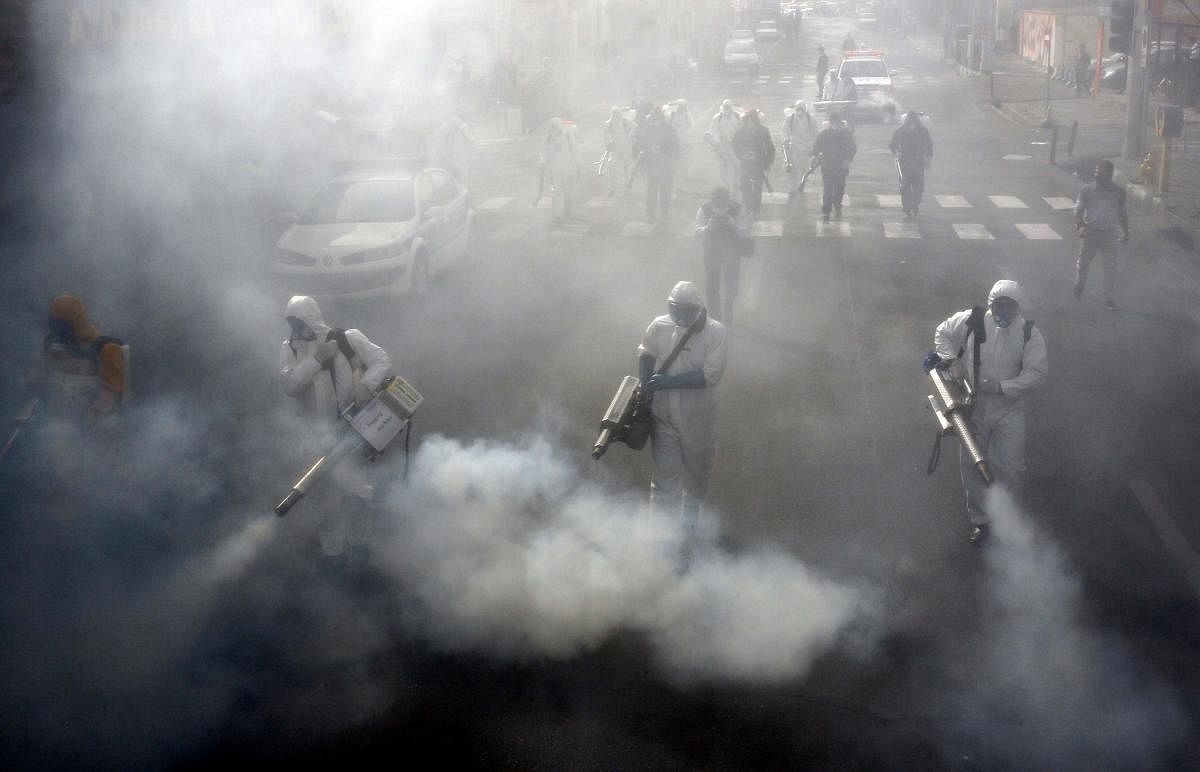  A file photo taken on March 13, 2020 shows Iranian Firefighters disinfect streets in the capital Tehran in a bid to halt the wild spread of coronavirus. Credit: AFP Photo