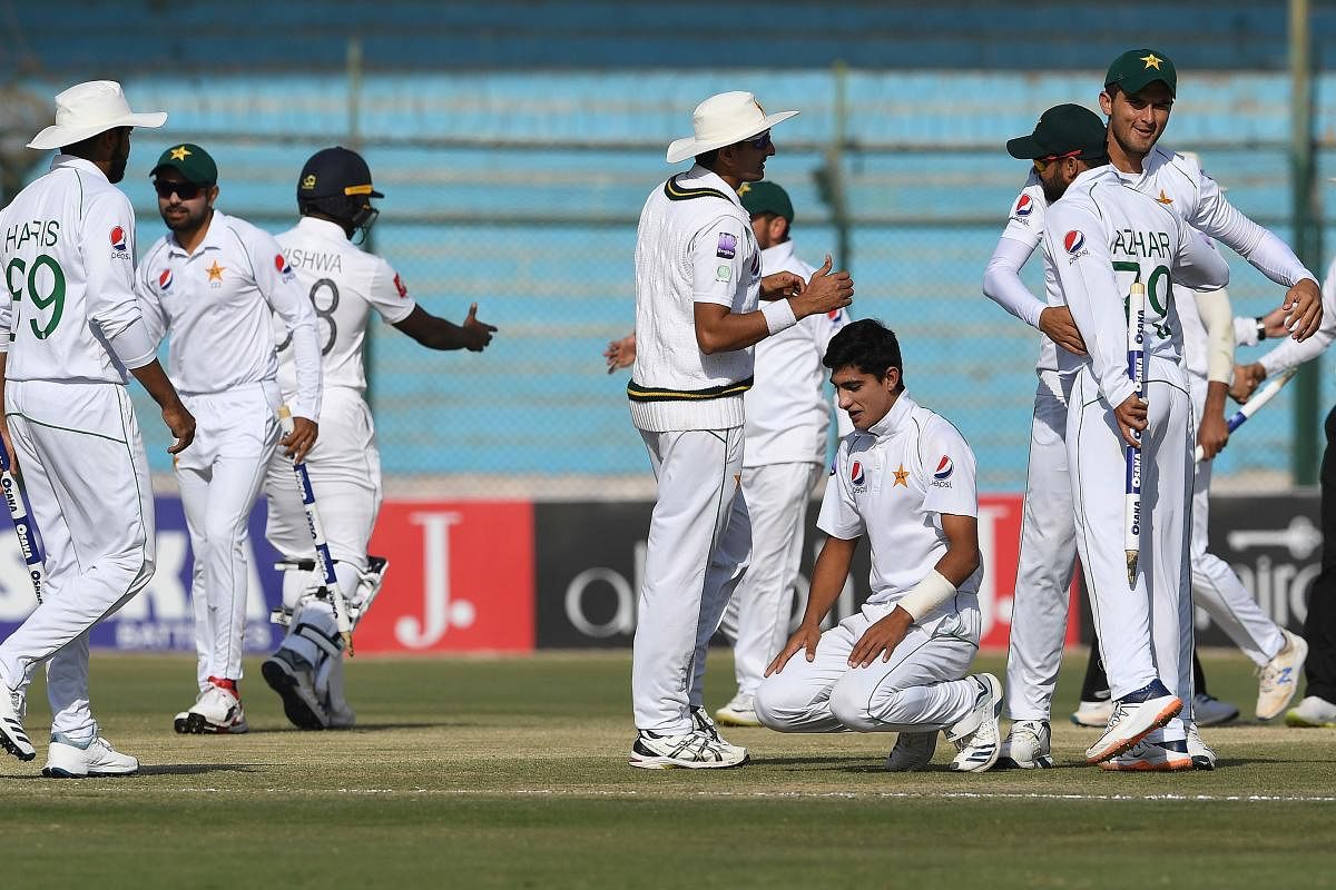Pakistan's cricketers celebrate after winning the second Test cricket match between Pakistan and Sri Lanka. (AFP Photo)