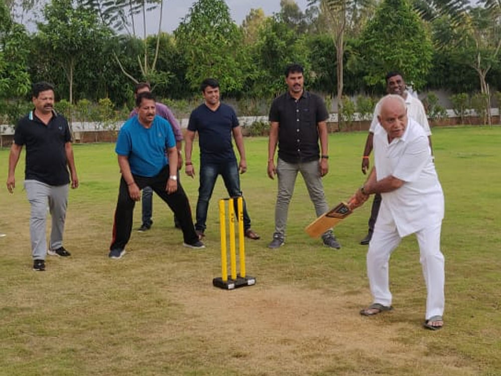 BJPs state unit media cell released a photo of Yeddyurappa playing cricket with party MLAs 