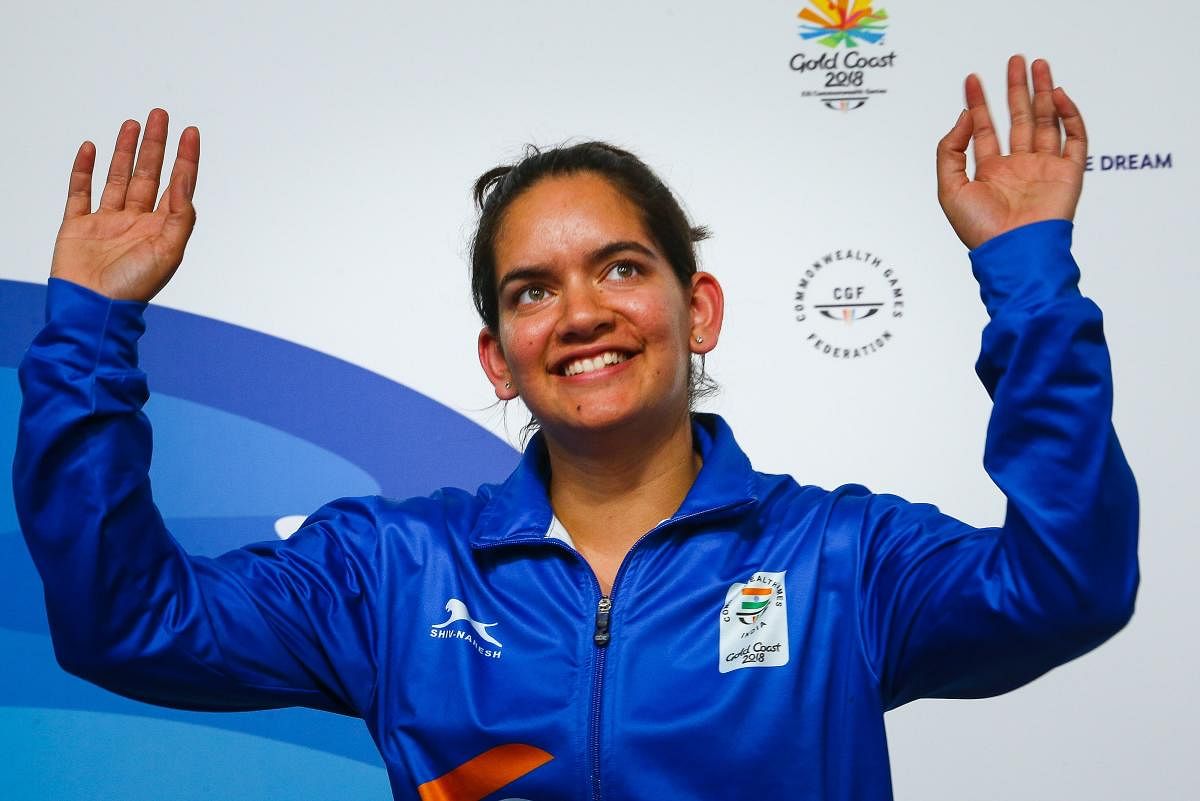 India's silver medallist Anjum Moudgil, celebrates on the podium during the medals ceremony after winning in the women's 50m rifle 3 positions shooting finals of the 2018 Gold Coast Commonwealth Games at the Belmont Shooting Complex in Brisbane on April 13, 2018. (AFP PHOTO)