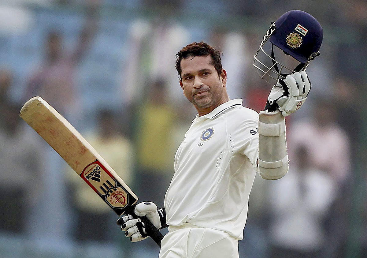 Sachin Tendulkar celebrates his 15,000 runs during the third day of the first cricket test match against West Indies, in New Delhi on Nov 8, 2011. (PTI Photo)