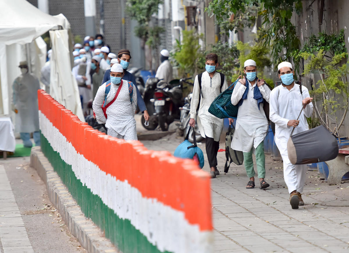 People who showed coronavirus symptoms being taken to various hospitals from Nizamuddin area in New Delhi. (PTI Photo)