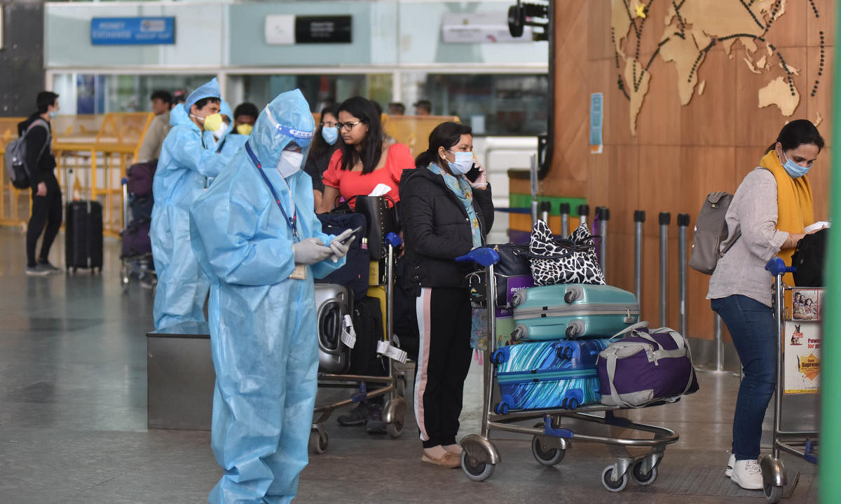 Passengers from the flight, Air India (AI 1803) coming from London, after landed Kempegowda International Airport went to 14 days quarantine at a bus, in Bengaluru on Monday early morning 11 May, 2020. (Photo by Janardhan B K)