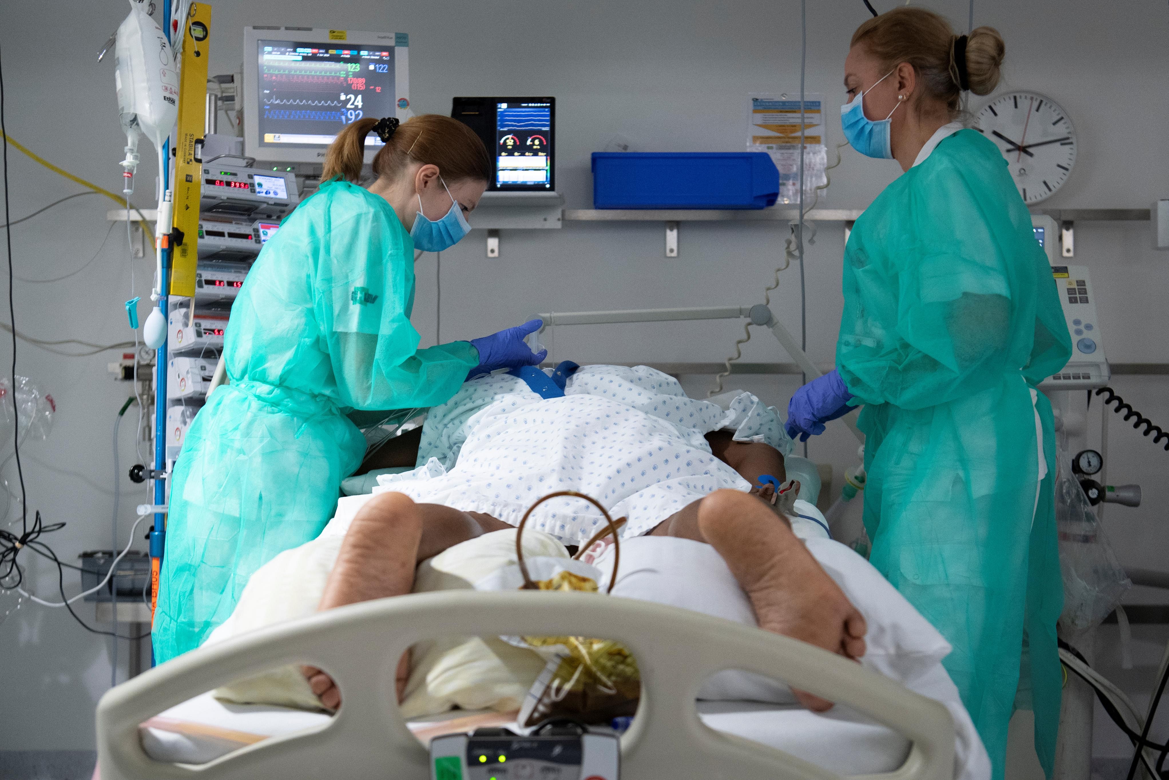 Staff treat a patient in the intensive care unit at the University Hospital (CHUV) during the coronavirus disease (COVID-19) outbreak in Lausanne, Switzerland. (Credit: Reuters)