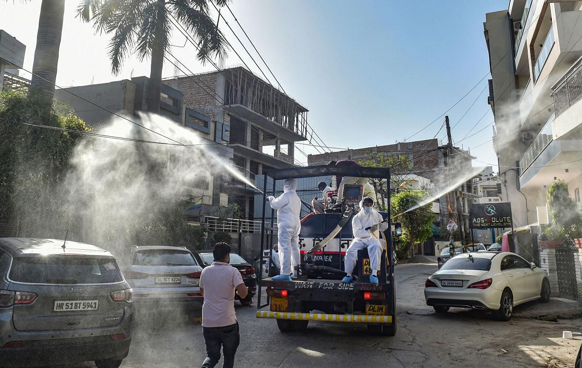 North MCD workers sanitise a locality in Model Town area to contain the spread of coronavirus, during the ongoing nationwide lockdown, in New Delhi, Monday, April 6, 2020. (PTI Photo)