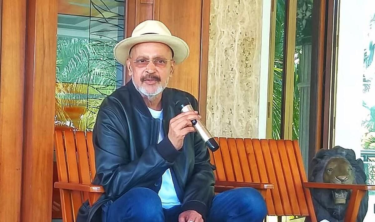 Muthappa Rai cheers the media persons at a press conference in his house near Bidadi, on the outskirts of Bengaluru. 