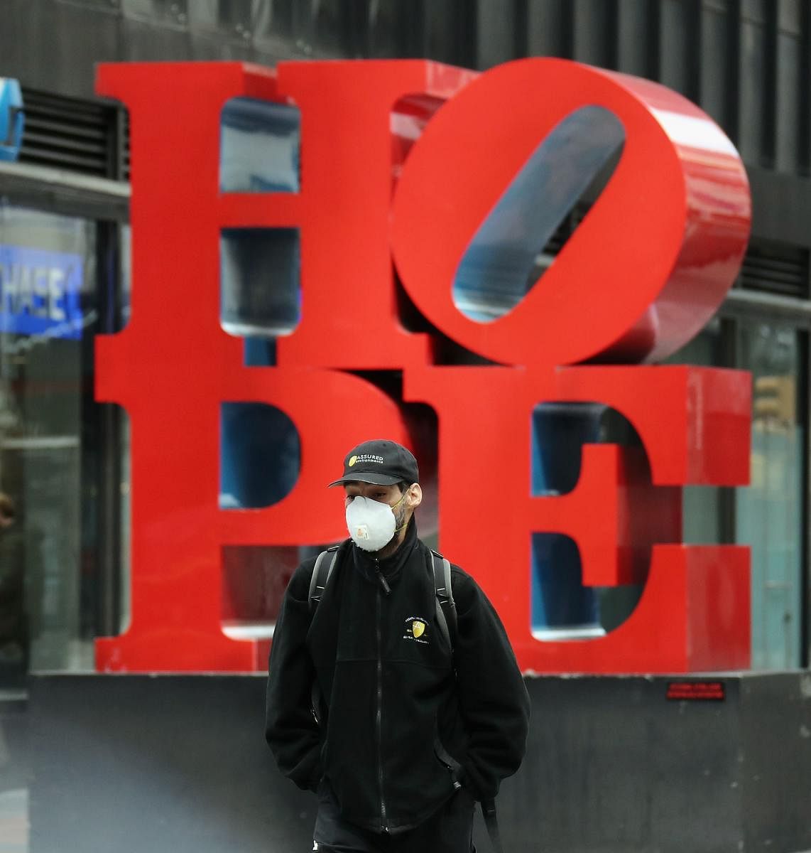 Pedestrians walk past a HOPE sign on 53rd Street and Seventh Avenue on April 02, 2020 in New York City. Currently, over 92,000 people in New York state have tested positive for COVID-19. (Getty Images/AFP)