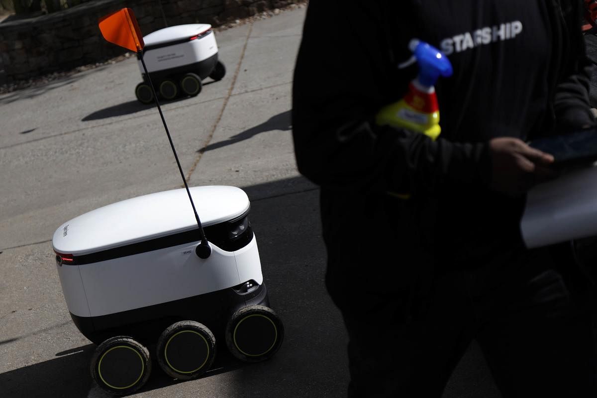 A Starship Technologies robot is ready to go after a cleaning by its operator outside the Broad Branch Market April 8, 2020 in Chevy Chase, Washington, DC. (AFP Photo)