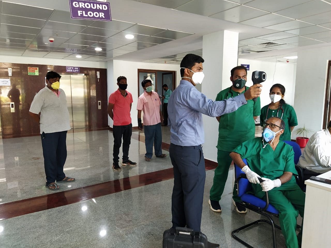 Doctors at KIMS use Infrared thermometers to monitor the temperatures of patients at the Super-Speciality hospital in the KIMS campus, where the Covid-19 patients are being treated. DH photo
