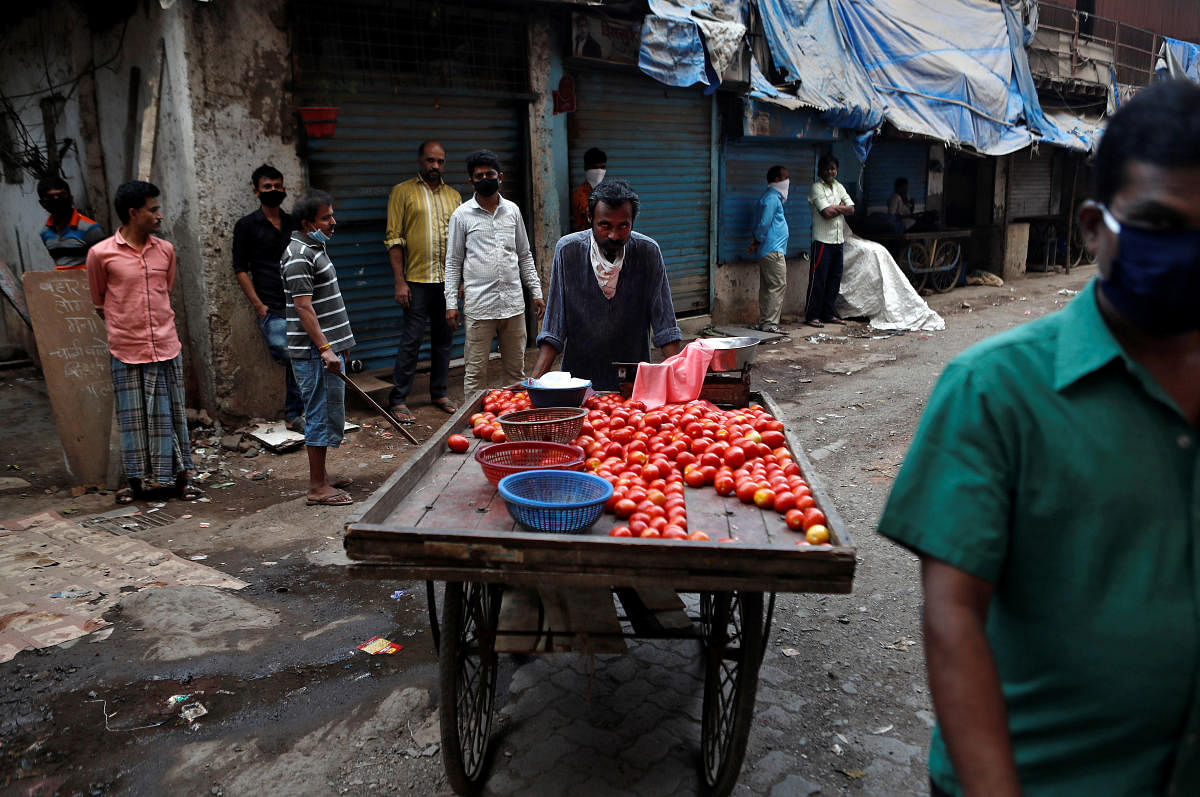 A food vendor selling tomatoes on the street (Reuters Photo)