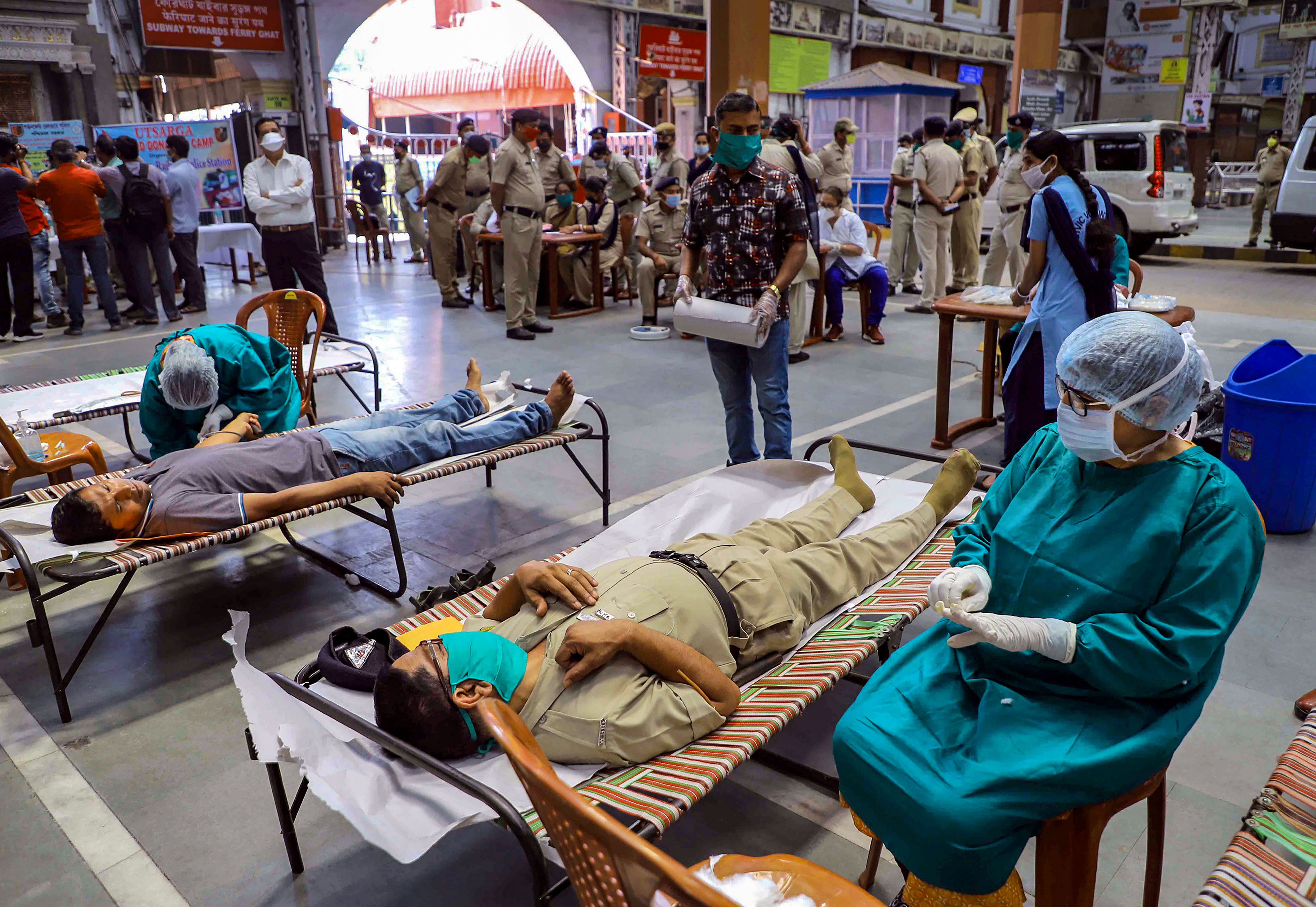 Railway Police personnel donate blood at Howrah station during a blood donation camp. (PTI Photo)