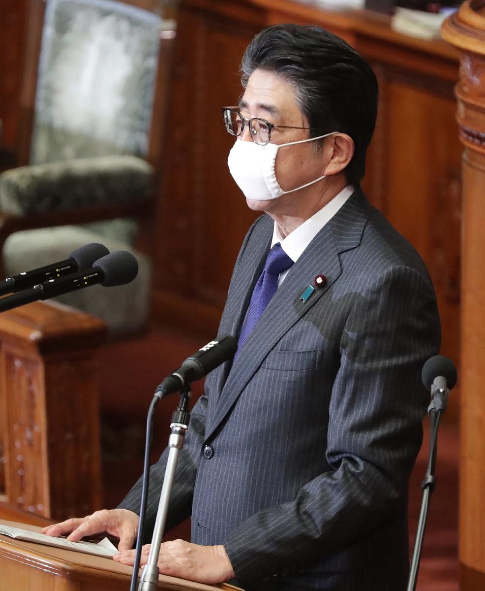 Japan's Prime Minister Shinzo Abe, wearing a face mask amid concerns over the spread of COVID-19 (AFP Photo)