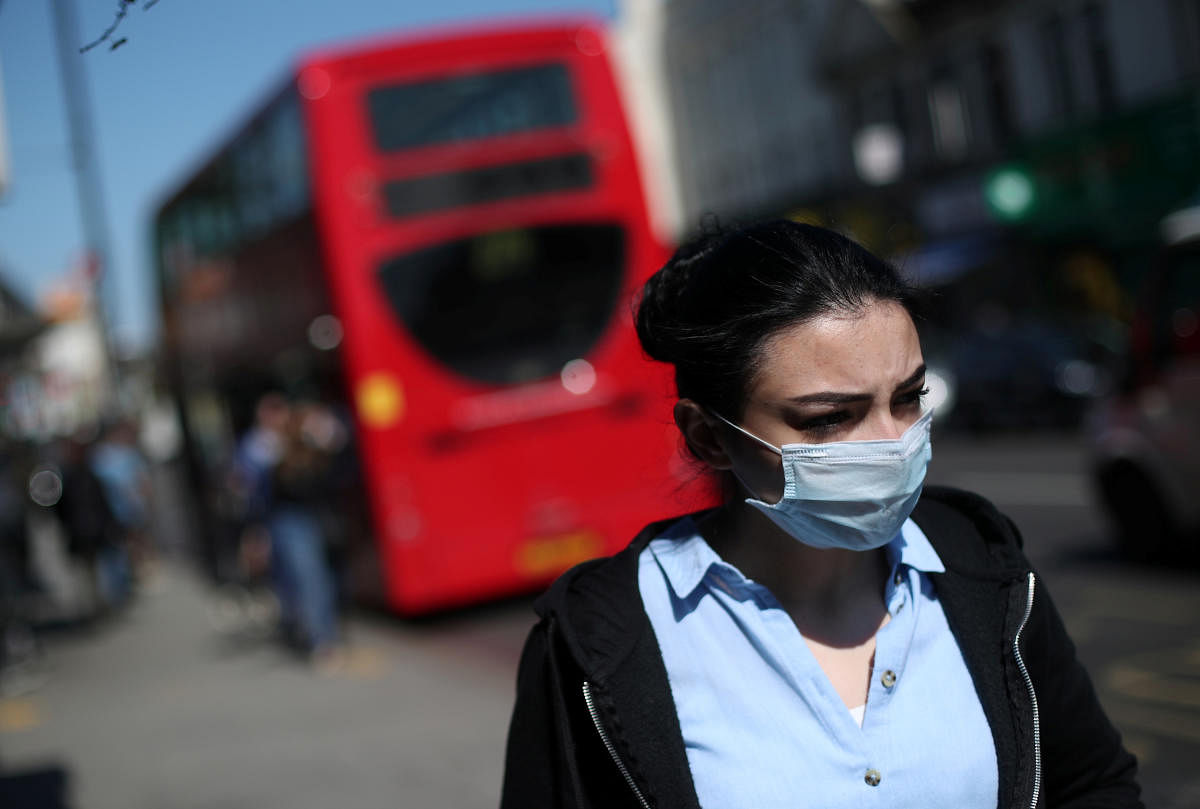 A woman wearing a mask in Tottenham as the spread of the coronavirus disease (COVID-19) continues, London, Britain, April 14, 2020. Credit: Reuters Photo